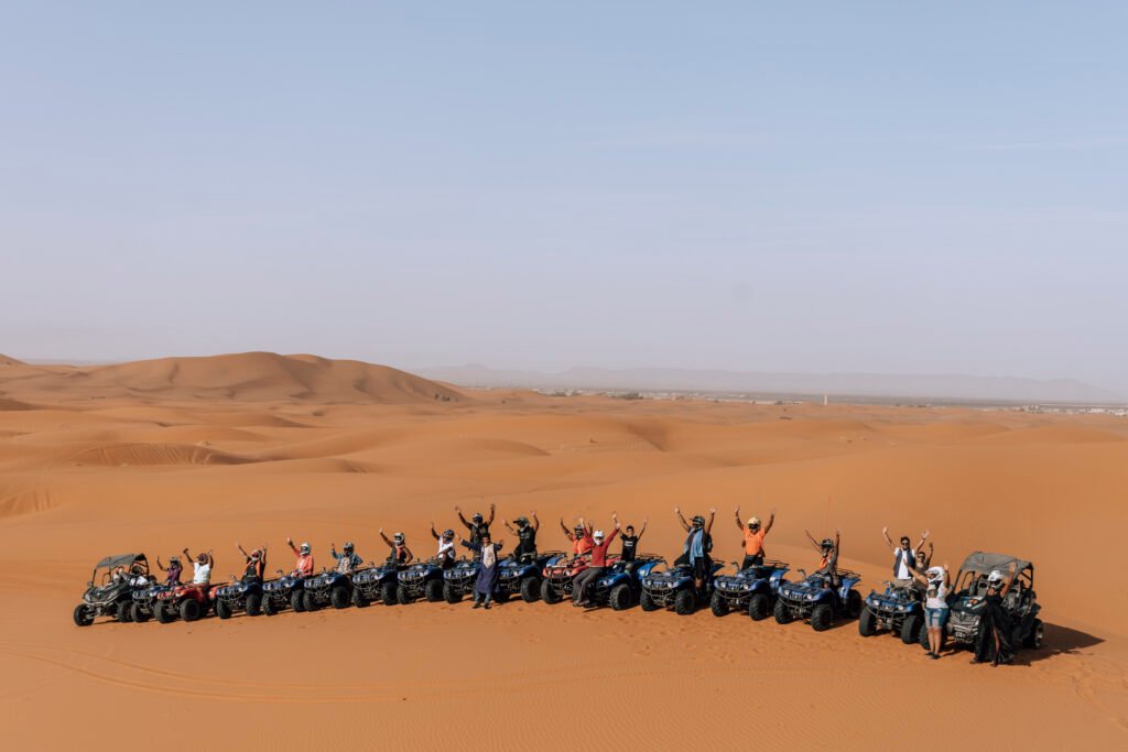 group of tourists in merzouga desert